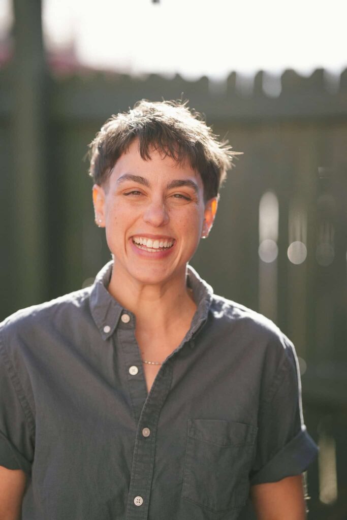A photograph of a queer person at Fort Green Bar in Denver, Colorado
