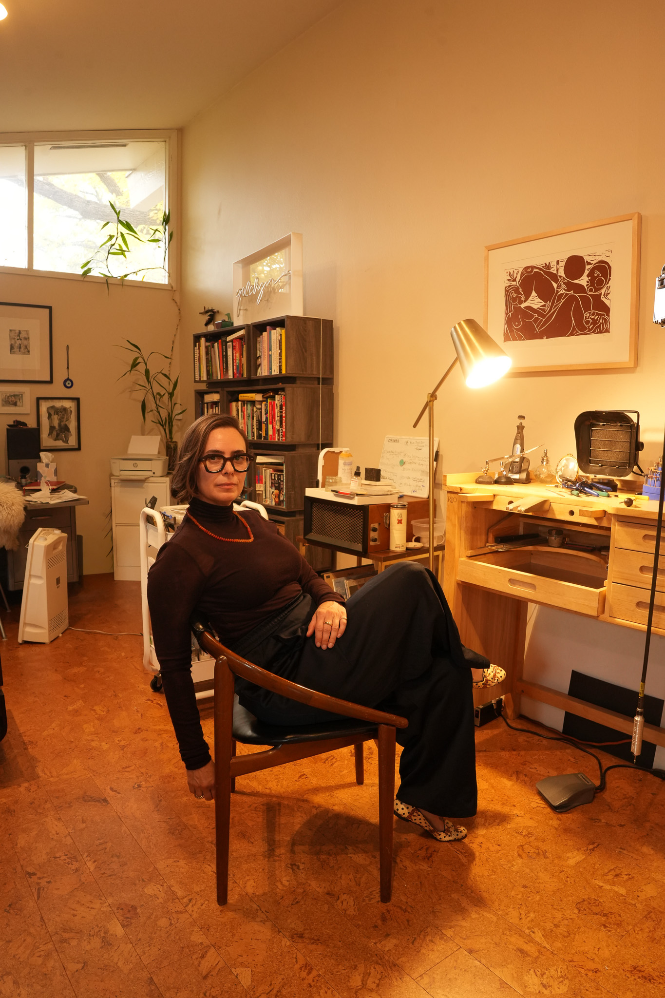 Vanessa Barcus sits at her desk in her at-home studio where she designs fine jewelry for Talisman